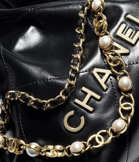 Chanel 22 mini handbag, Shiny calfskin, imitation pearls & gold 